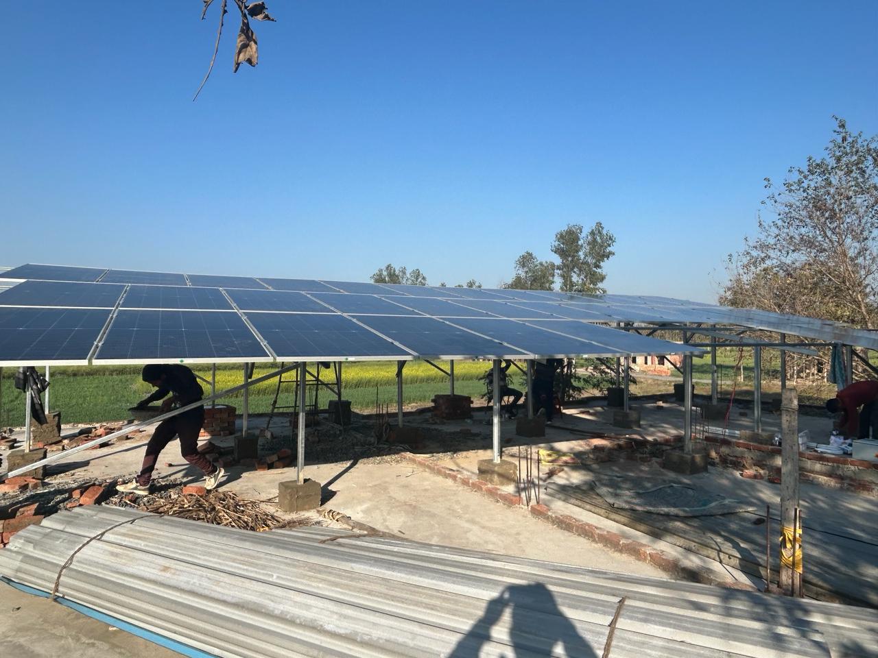 N K Enterprises team installing solar panels